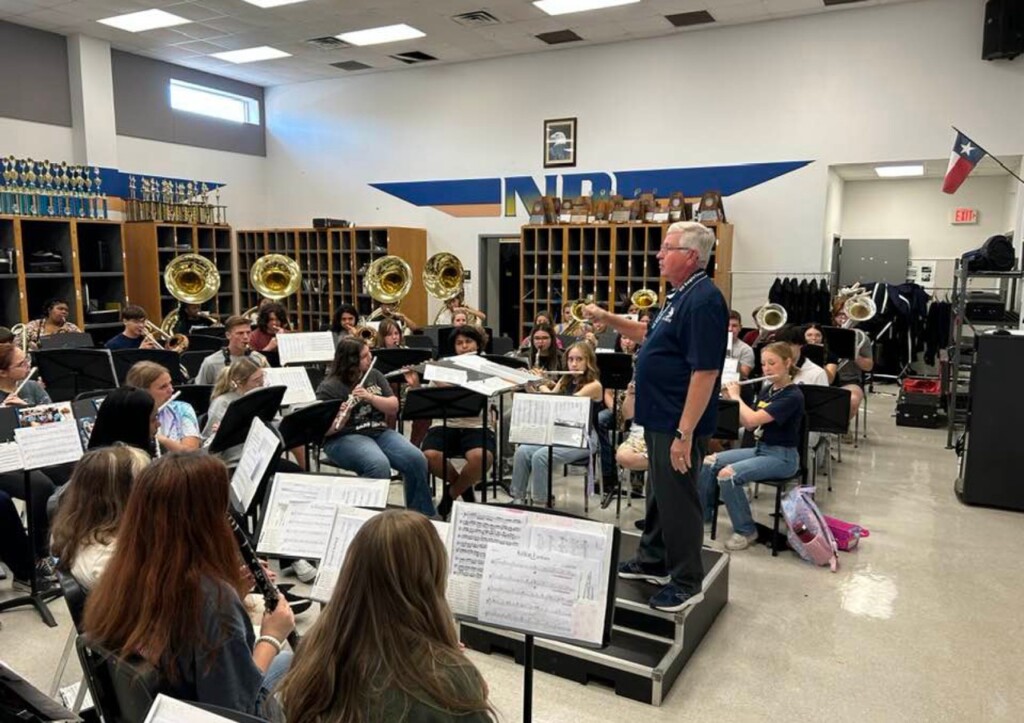 photograph of students practicing in existing NDISD band hall